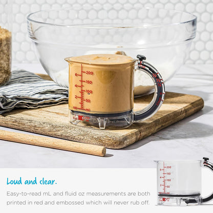 Upcup All-in-1 Adjustable Measuring Cup, Metric & Imperial Measurements up to 1 Cup - Black/Clear | Measures dry and liquid ingredients and scrapes itself clean, easy-to-read metric and imperial measurements, microwave safe