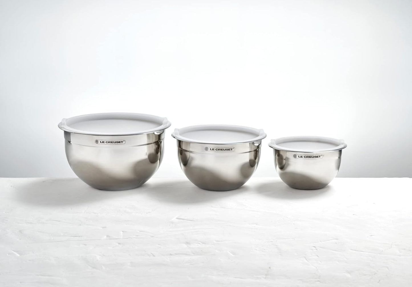 Le Creuset Set of 3 Nested Mixing Bowls w/Nonslip Silicone Base & Plastic Air Tight Lids