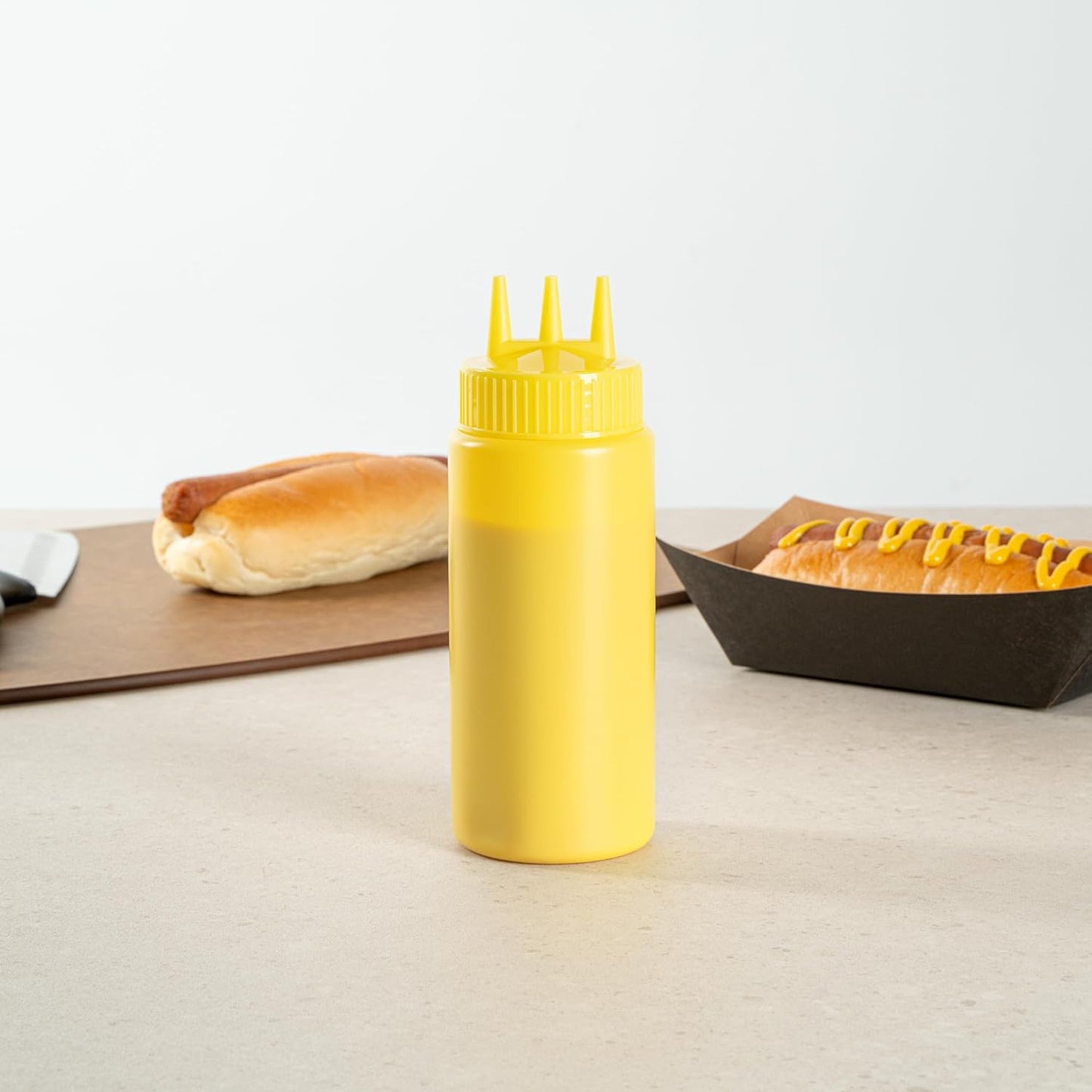 Restaurantware Plastic Squeeze Bottle 20 oz Refillable Condiment Bottle Large Valve Dishwashable Yellow Inverted Sauce Dispenser For Thick Condiments, Dressings, Batter, Sour Cream, And Syrups