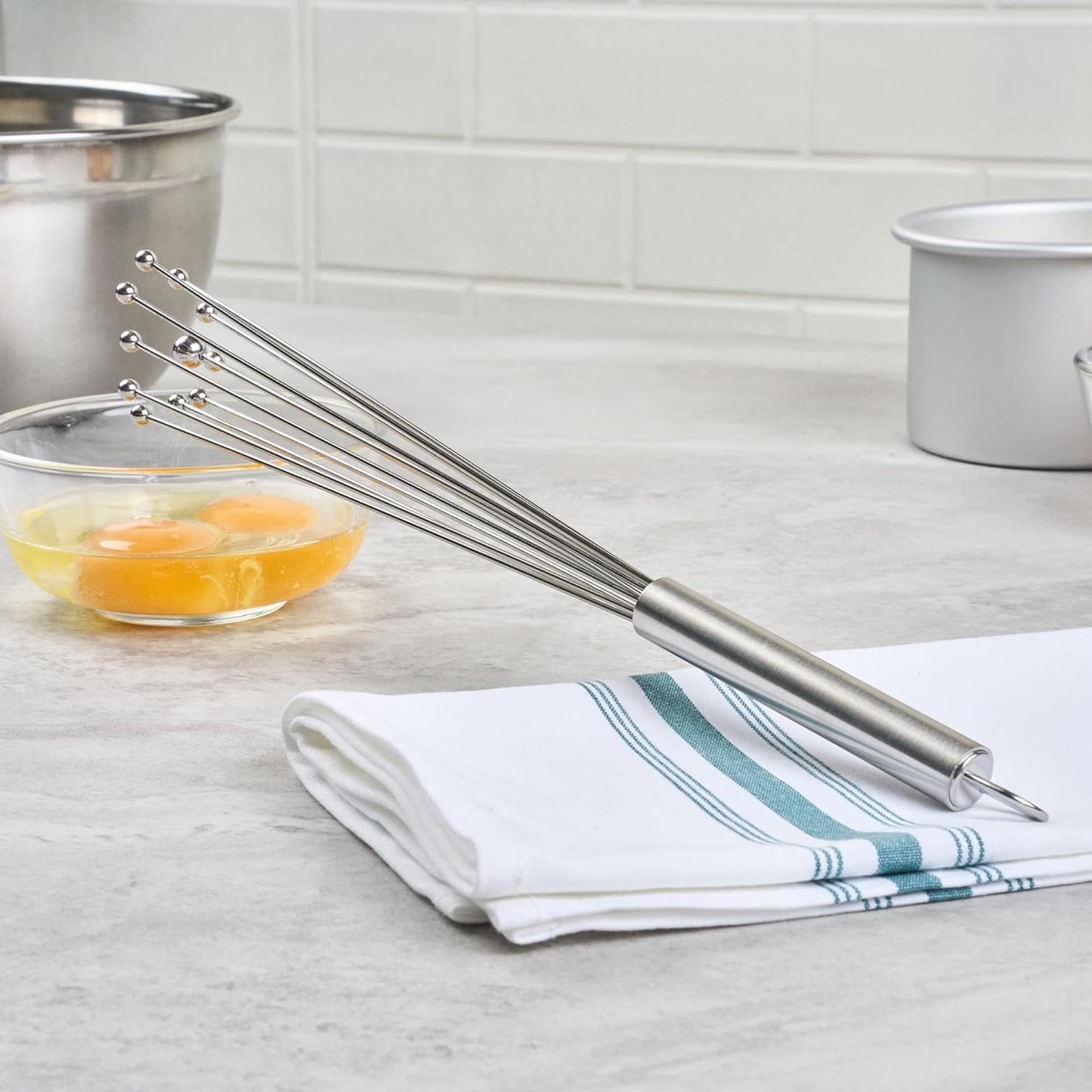 Restaurantware 10.5 in Stainless Steel Ball Whisk - German Standard Egg Beater with Ergonomic Handle, Dishwasher Safe - Manual Mixer Cooking Whisk for Baking, Stirring, Sauces, Beating