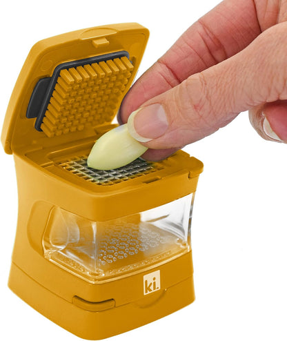 Garlic-A-Peel Garlic Press, Crusher, Cutter, Mincer, and Storage Container - Includes Silicone Garlic Peeler - Easy to Clean - Stainless Steel Blades – (Black), standard