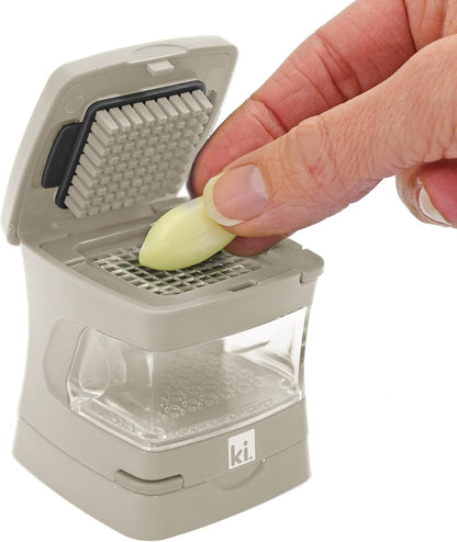 Garlic-A-Peel Garlic Press, Crusher, Cutter, Mincer, and Storage Container - Includes Silicone Garlic Peeler - Easy to Clean - Stainless Steel Blades – (Black), standard