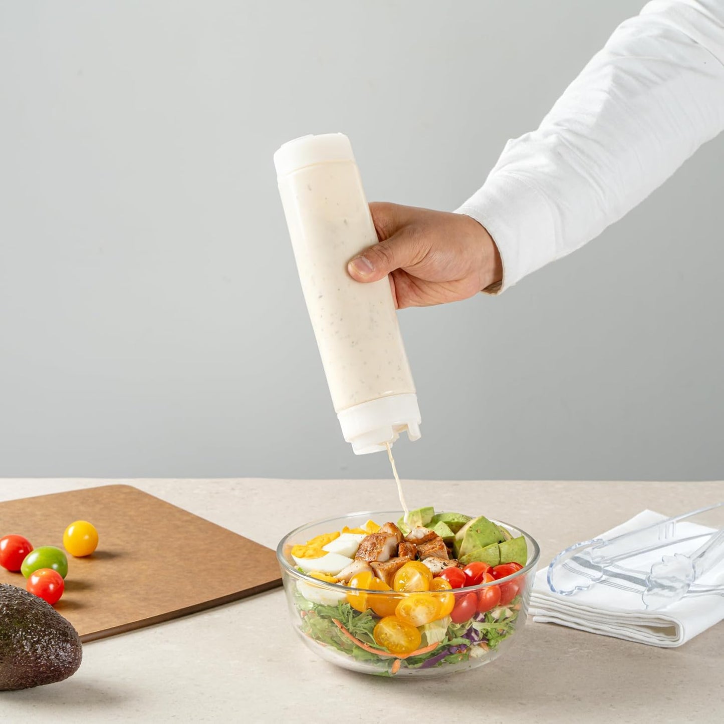 Restaurantware Plastic Squeeze Bottle 16 oz Refillable Condiment Bottle Large Valve Dishwashable Clear Inverted Sauce Dispenser For Thick Condiments, Dressings, Batter, Sour Cream, And Syrups