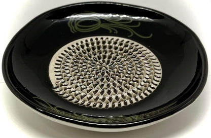 BonCera, All-in-one Premium Ceramic Garlic Grater Plate 4-Piece Set - Black Garlic Design - for Garlic, Ginger, Chocolate, and More! - Comes with 5.25" Plate, Peeler, Brush, and Stand