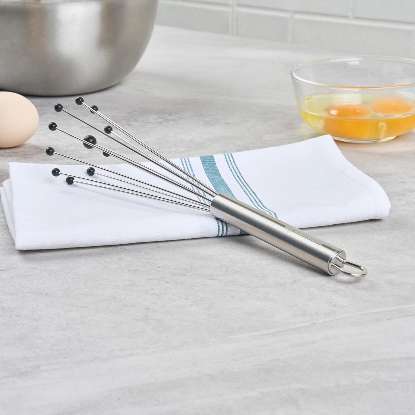 Restaurantware 10.5 in Stainless Steel Ball Whisk - German Standard Egg Beater with Ergonomic Handle, Dishwasher Safe - Manual Mixer Cooking Whisk for Baking, Stirring, Sauces, Beating