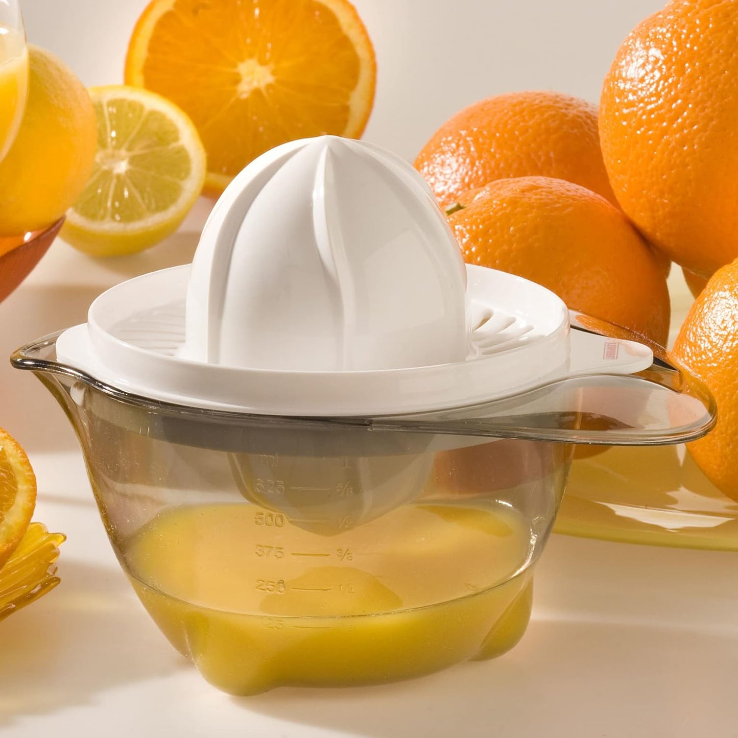 Leifheit Manual Citrus Juicer – Durable Stainless Steel & ABS Plastic, Dual Juicing Cones for Oranges, Lemons & Limes, Measuring Cup with Spout, Easy to Clean, Dishwasher Safe – White