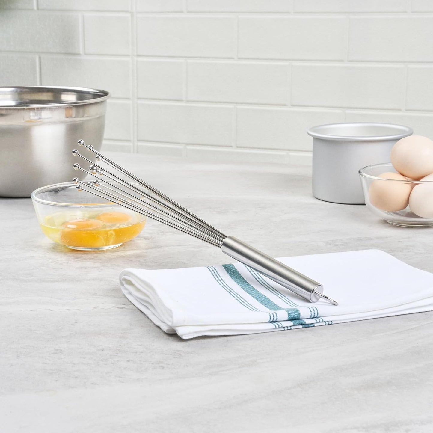 Restaurantware 10.5 in Stainless Steel Ball Whisk - German Standard Egg Beater with Ergonomic Handle, Dishwasher Safe - Manual Mixer Cooking Whisk for Baking, Stirring, Sauces, Beating