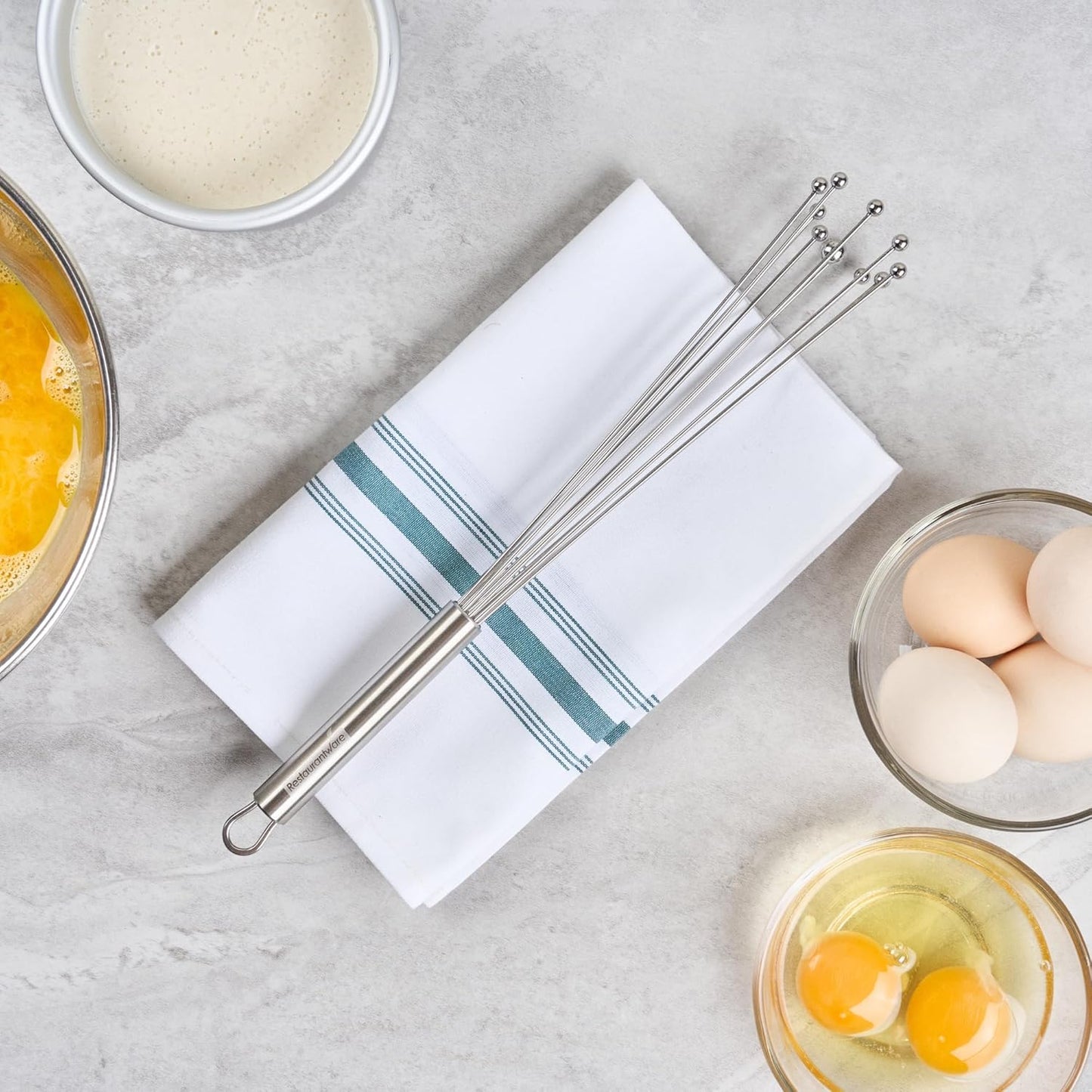 Restaurantware 10.5 in Stainless Steel Ball Whisk - German Standard Egg Beater with Ergonomic Handle, Dishwasher Safe - Manual Mixer Cooking Whisk for Baking, Stirring, Sauces, Beating
