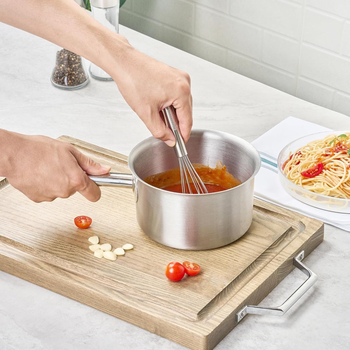 Restaurantware 10.5 in Stainless Steel Ball Whisk - German Standard Egg Beater with Ergonomic Handle, Dishwasher Safe - Manual Mixer Cooking Whisk for Baking, Stirring, Sauces, Beating