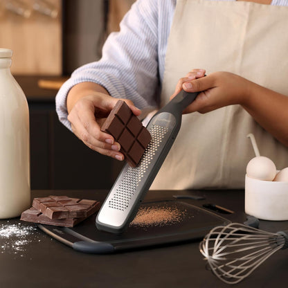 Zyliss Fine Grater and Zester - Handheld Grater with Stainless Steel Blade & Wheat Straw Handle - Ideal for Hard Cheese, Chocolate, Fruit, Vegetables, & More - Protective Cover Doubles as Scraper