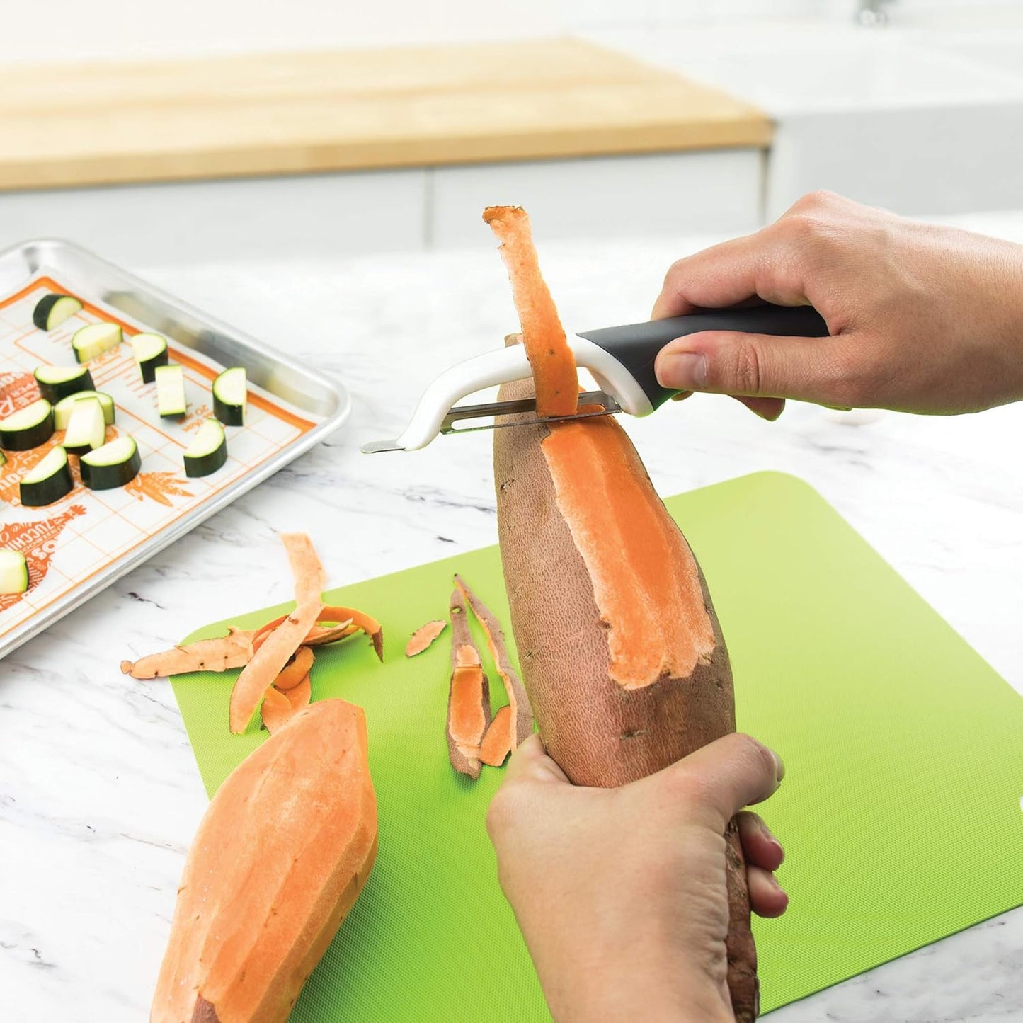 Tovolo Vegetable Peeler with Ultra Sharp Stainless Steel Swivel Blade Non Slip Handle, Multi Functional Dishwasher Safe Kitchen Wide Ribbon Potato Peeler for Fruit Veggies Carrots Apples, Thyme Green