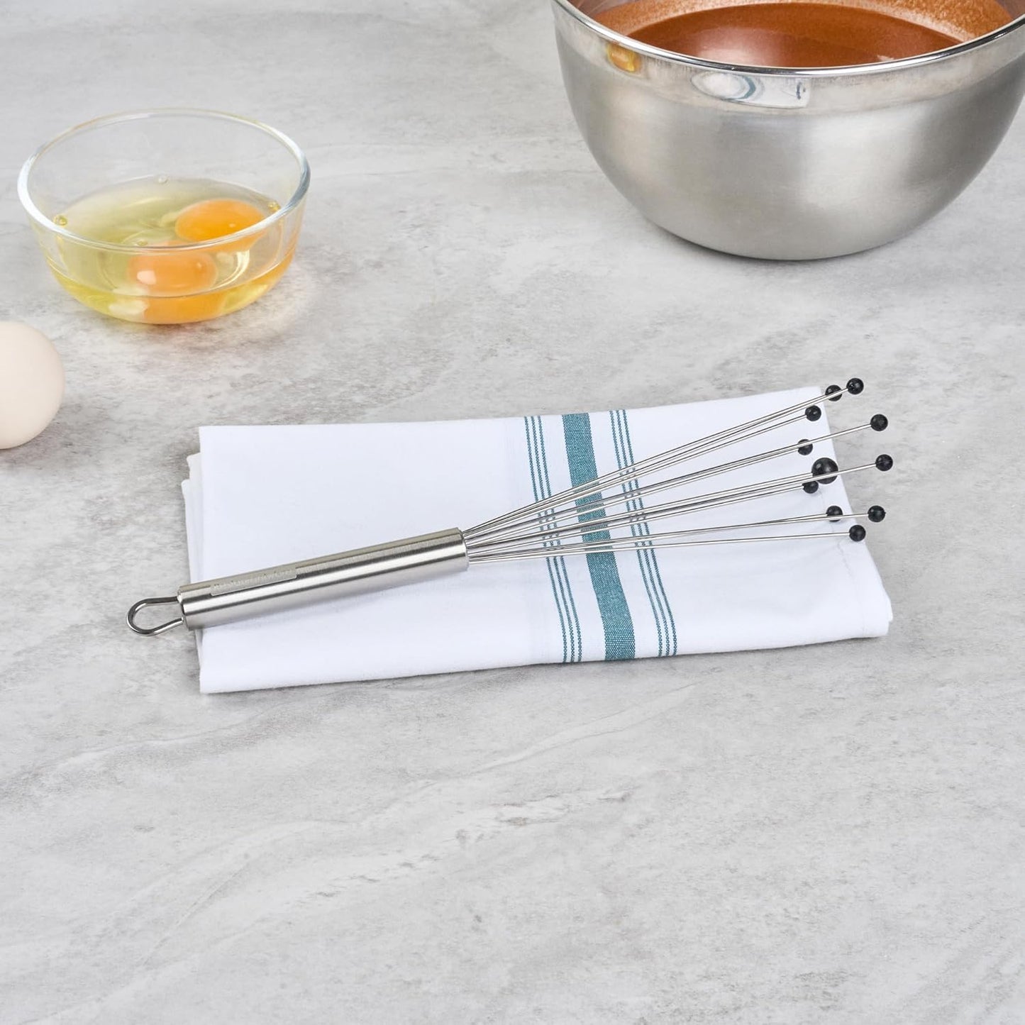 Restaurantware 10.5 in Stainless Steel Ball Whisk - German Standard Egg Beater with Ergonomic Handle, Dishwasher Safe - Manual Mixer Cooking Whisk for Baking, Stirring, Sauces, Beating