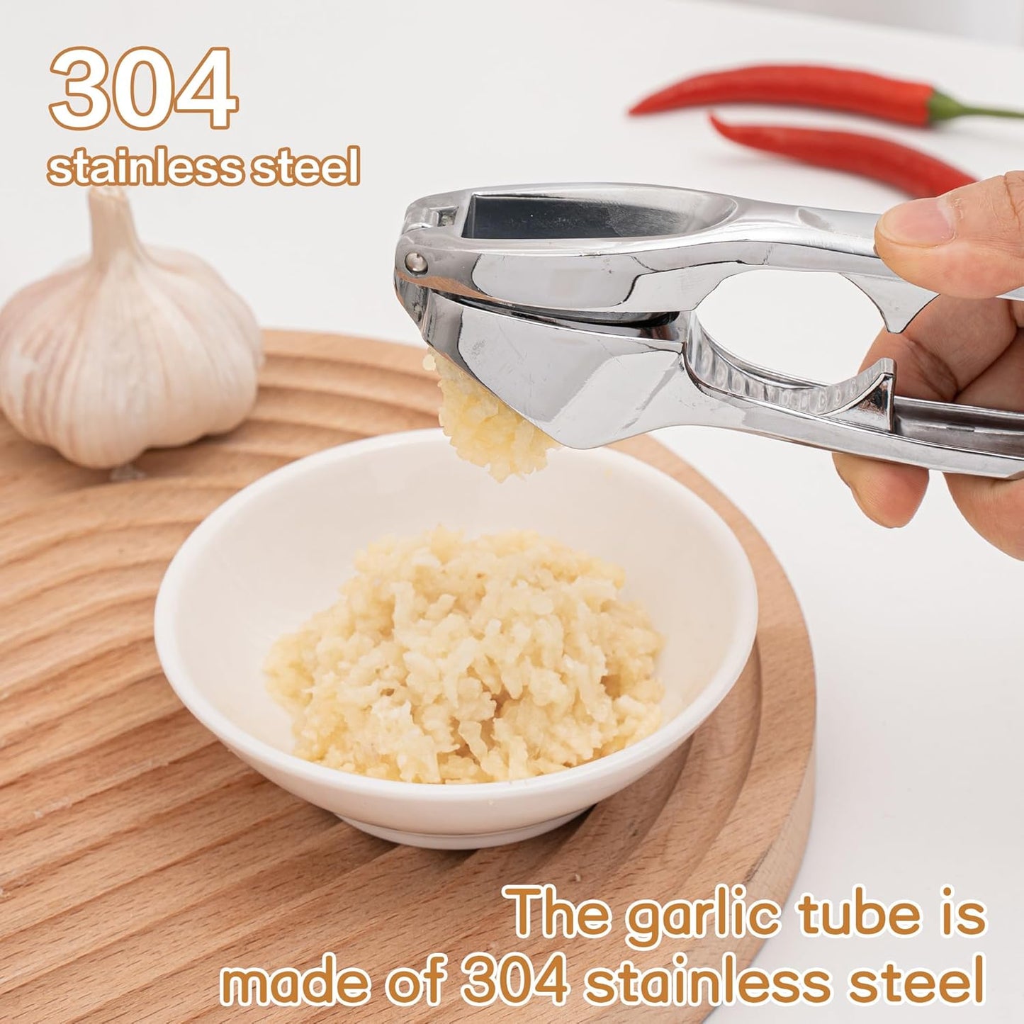 Kitchen Premium Garlic Press - Zinc Alloy Garlic Press effortlessly crushes garlic cloves, ginger chunks, nuts, and seeds. Comfortable to use and dishwasher safe.