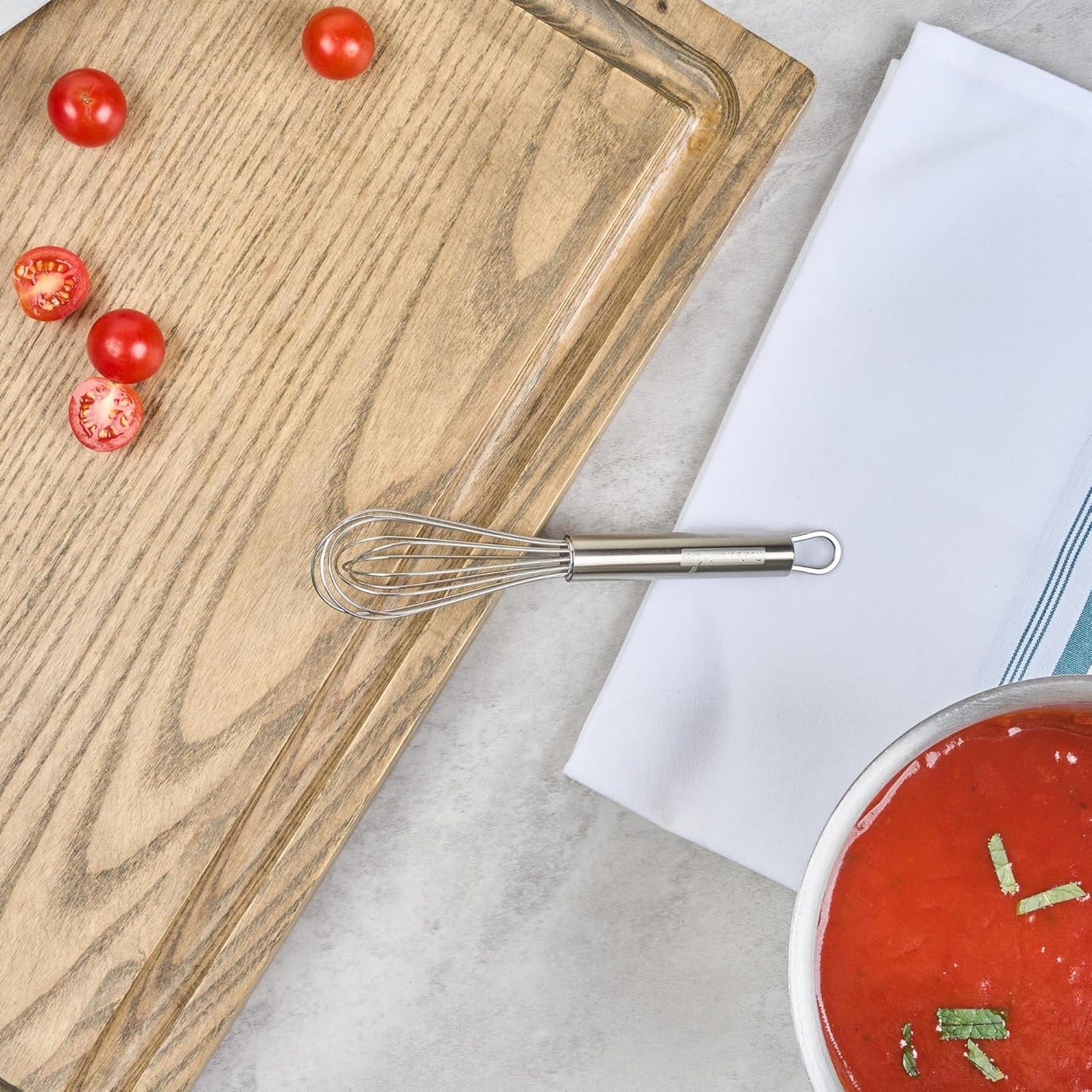 Restaurantware 10.5 in Stainless Steel Ball Whisk - German Standard Egg Beater with Ergonomic Handle, Dishwasher Safe - Manual Mixer Cooking Whisk for Baking, Stirring, Sauces, Beating
