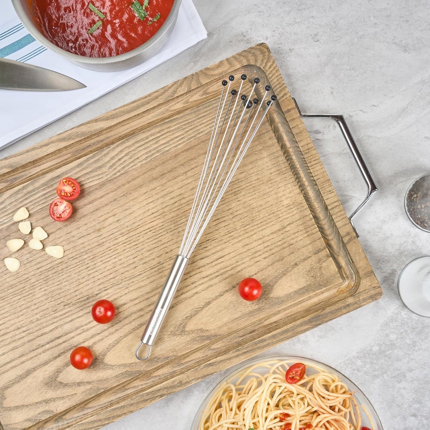 Restaurantware 10.5 in Stainless Steel Ball Whisk - German Standard Egg Beater with Ergonomic Handle, Dishwasher Safe - Manual Mixer Cooking Whisk for Baking, Stirring, Sauces, Beating