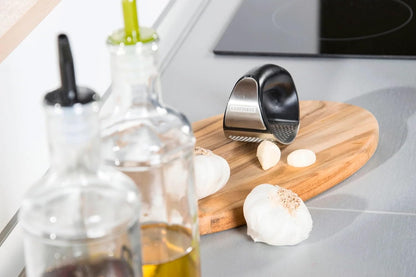 Garlic-King Proline Garlic Press Rocker, Time Saving, Durable Strong Mincer Tool - Easy to Use & Clean Crusher, Dishwasher Safe, Kitchen Gadget Smasher, Black/Silver