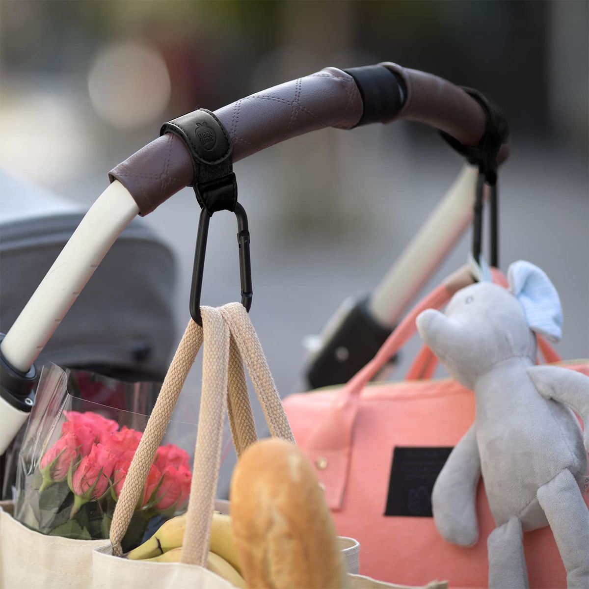 Stroller Hooks for Bags (2 Pack) - Non-Slip, One-Hand Use, 11 lb | These universal stroller clips open one-handed, resist slipping, and each carabiner hook holds 11 lbs—a travel essential.