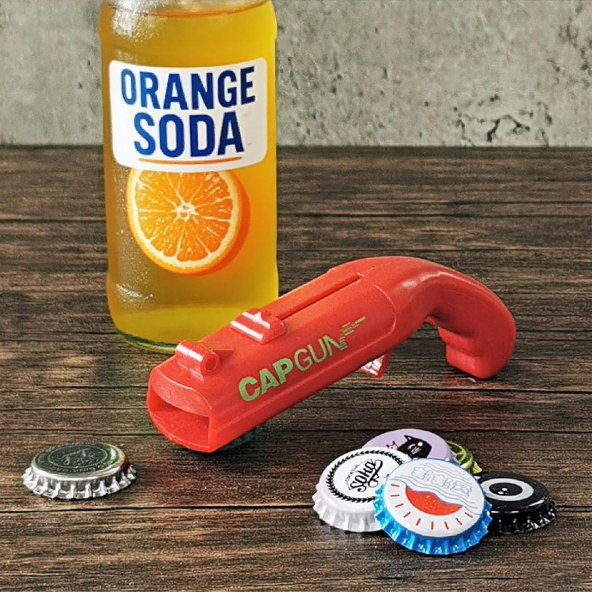 bottle cap shooting gun - Fun bottle opener tool launches bottle caps for parties, barbecues, and bar games (color)