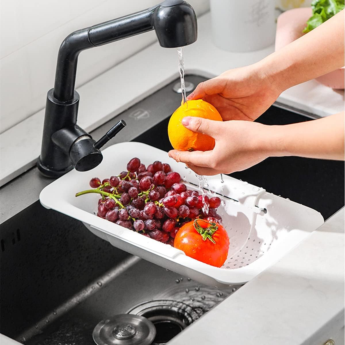 Collapsible Sink Colanders and Strainers Basket Over the Sink Colander Collapsible Colander Extendable Plastic Fruit Vegetable Strainer Drainer Basket for Kitchen(Length 14.3 inch-19.4 inch) (Pink)