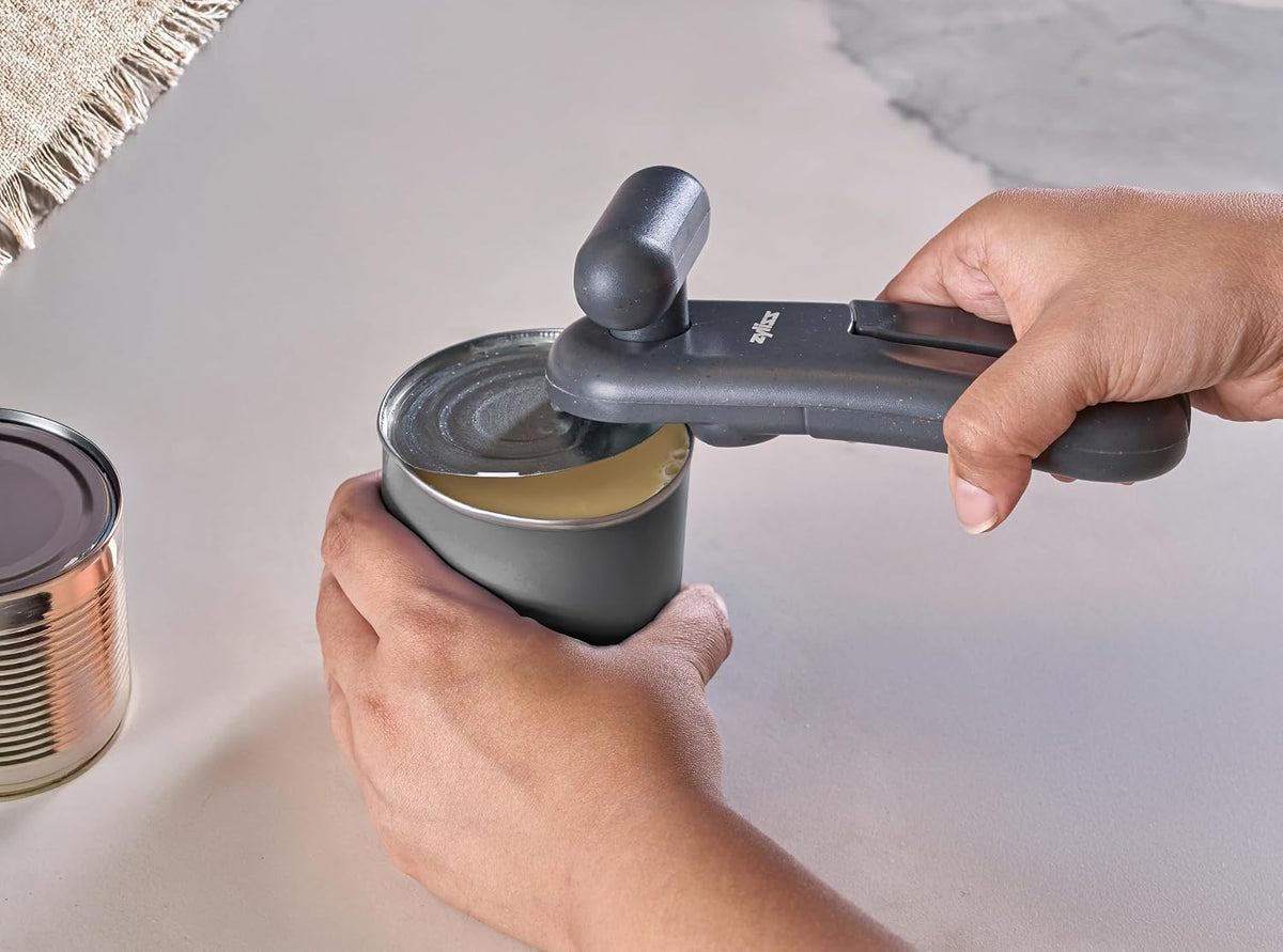MagiCan Manual Can Opener with Lid Release - Heavy Duty Can Opener - Easy to Use Hand Held - Effortlessly Open Cans - Compact Design - Red