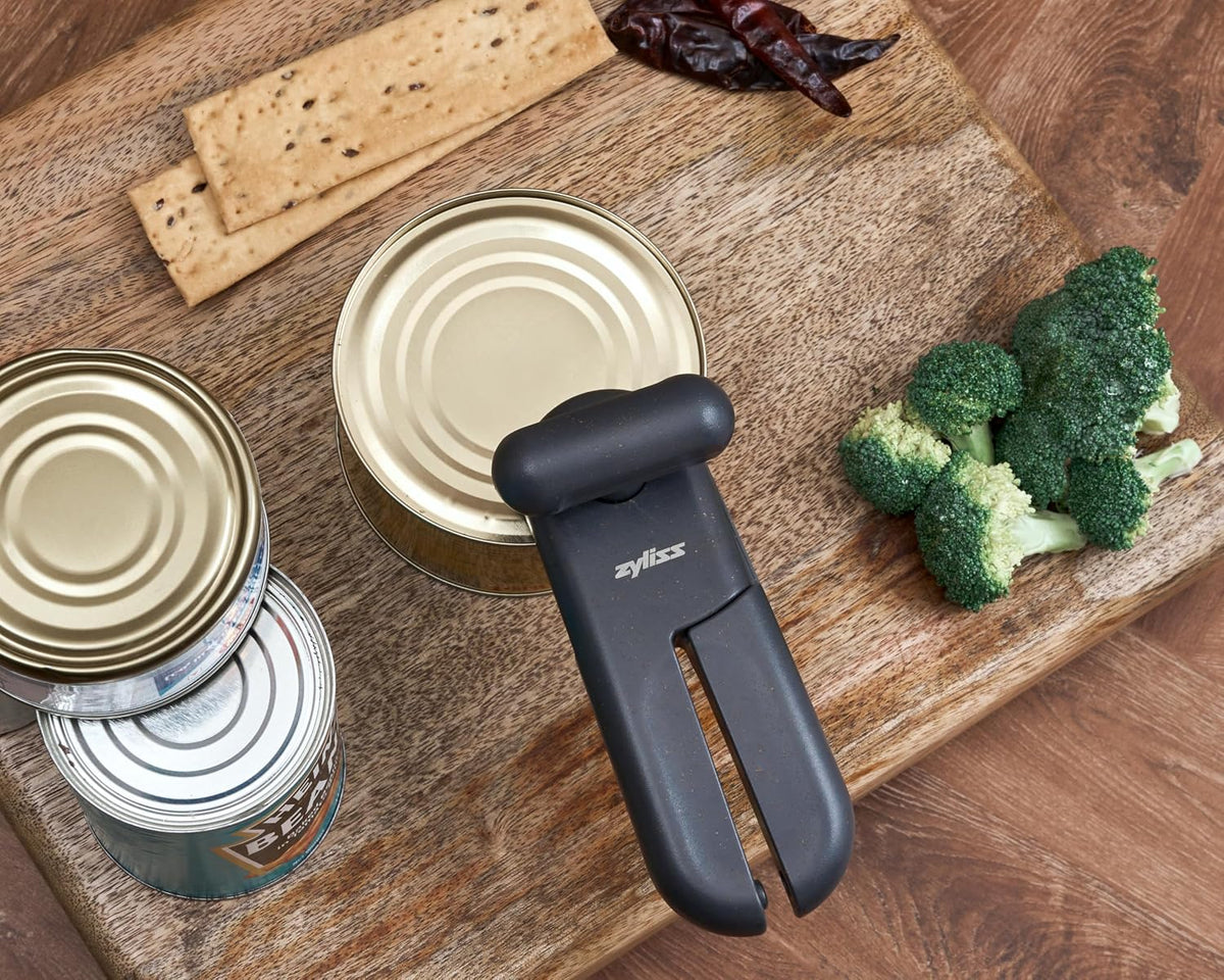 MagiCan Manual Can Opener with Lid Release - Heavy Duty Can Opener - Easy to Use Hand Held - Effortlessly Open Cans - Compact Design - Red